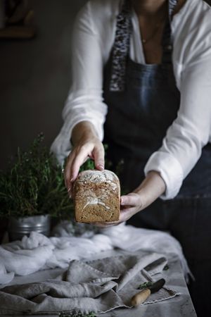 Fresh bread on napkin near tomatoes jam