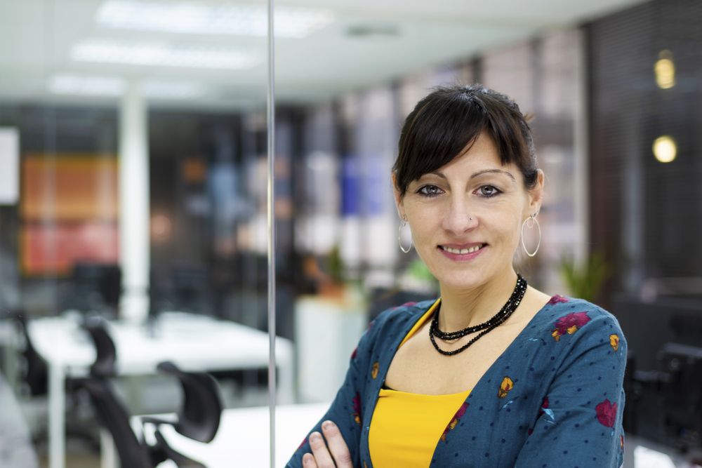 Confident businesswoman standing in office