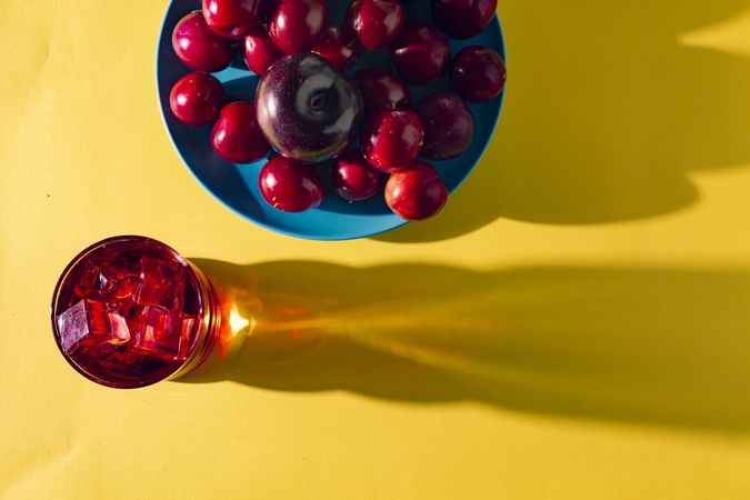 Red drink near fresh fruits