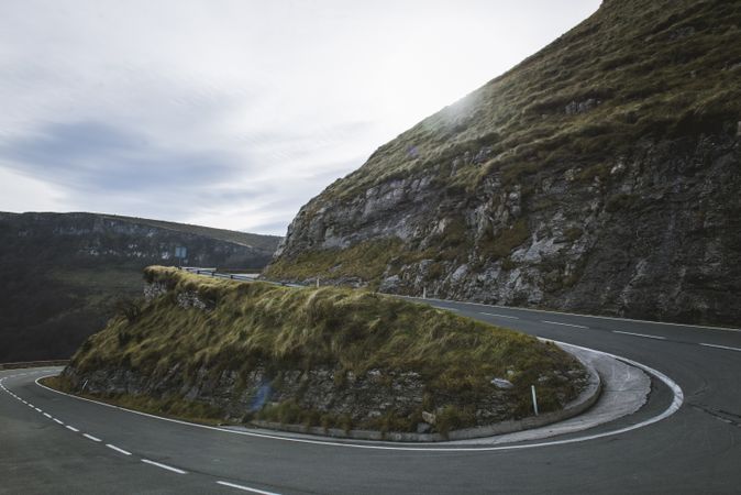 Road leaning between mountains