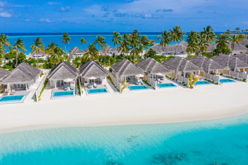Holiday villas line the beach in the Maldives