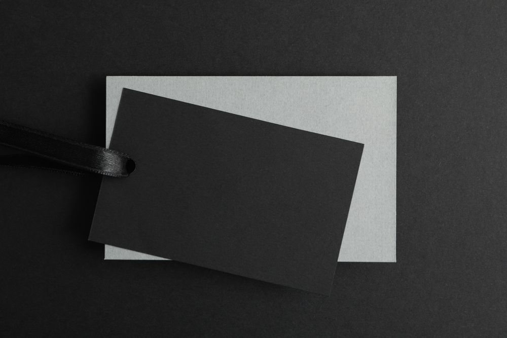 Sale tags on dark background, space for text