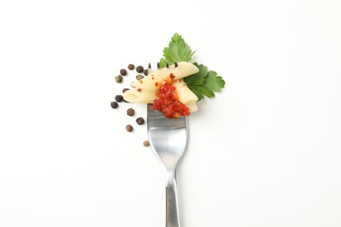 Fork with tasty pasta isolated on blank background