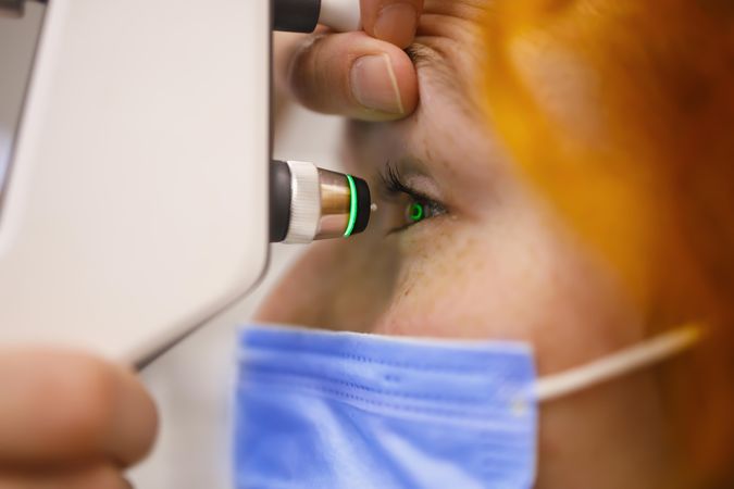 Close up of woman having her eyes checked in optometrist