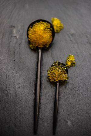 Yellow trout caviar on spoons