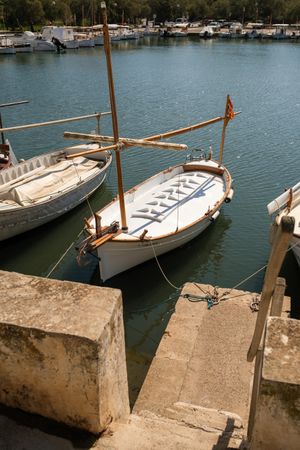Boats with mast in city port