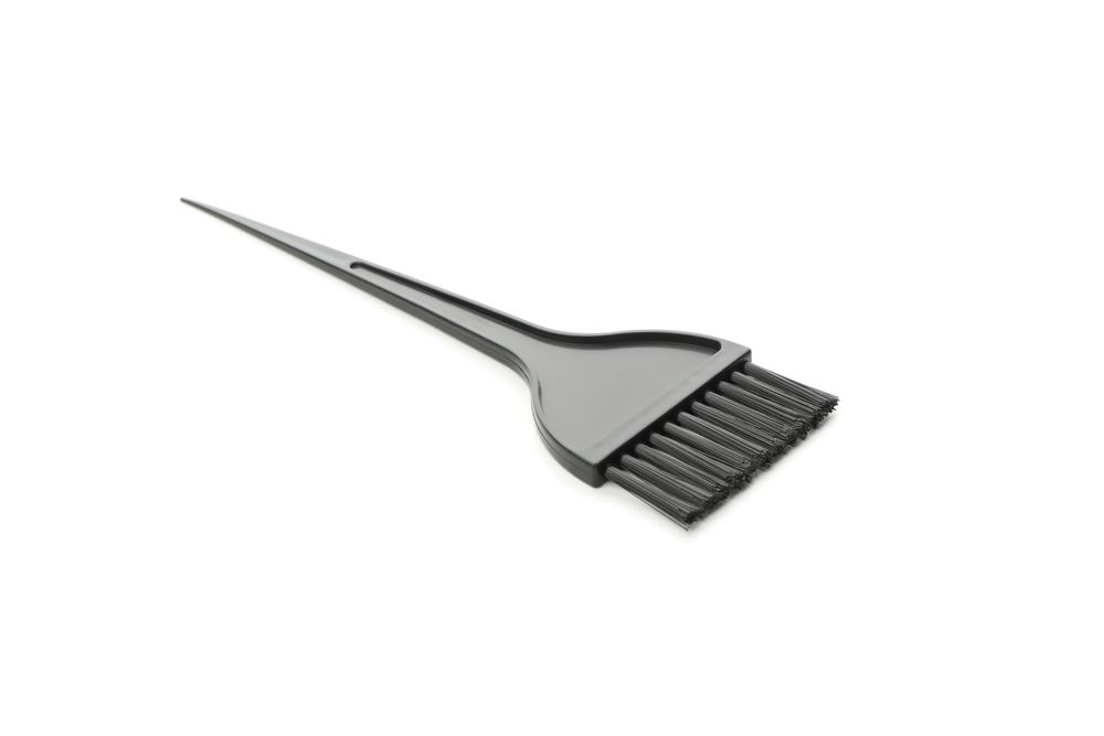 Hair dye brush isolated on plain background