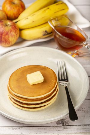 Delicious pancakes with butter and honey.
