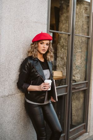 Woman with drink on the street