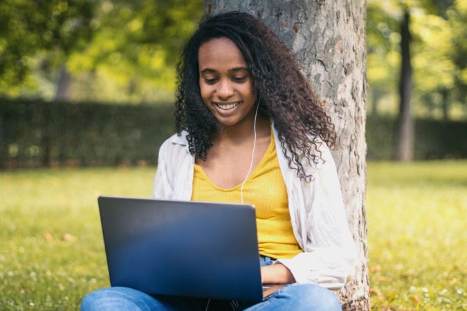 College student working with laptop on campus