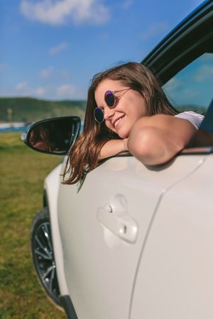 Woman leaning on window of the car