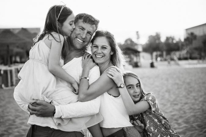 Beautiful happy family with children on beach
