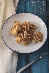 Homemade tasty sweet rolls on plates