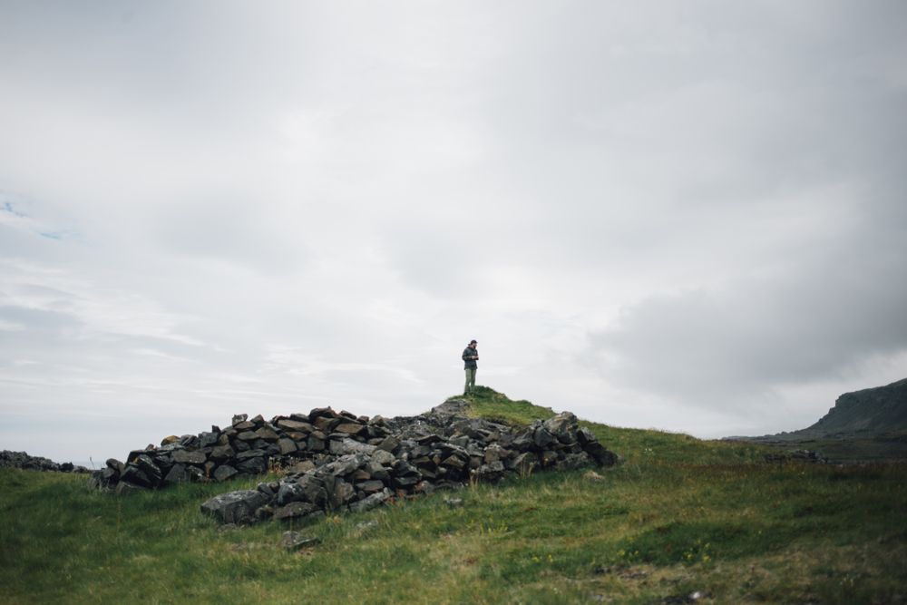 Man on top of rocky mound