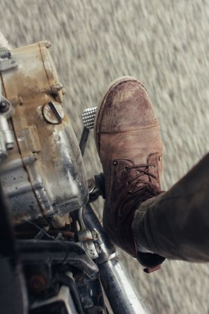 Crop leg on motorcycle pedal