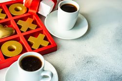 St. Valentine day card concept with present and two cups of espresso