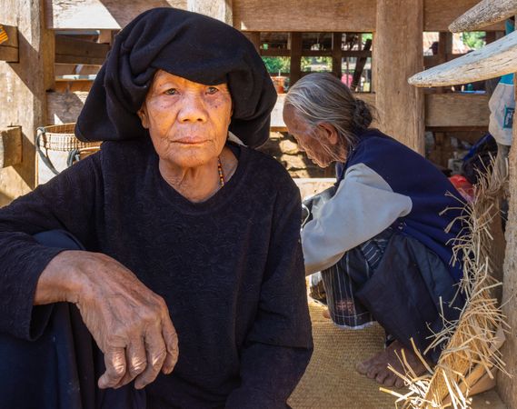 Sulawesi Island, Indonesia - August, 15 2015: Older women in shed in village