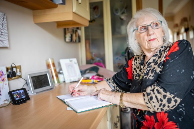 Woman writing at home