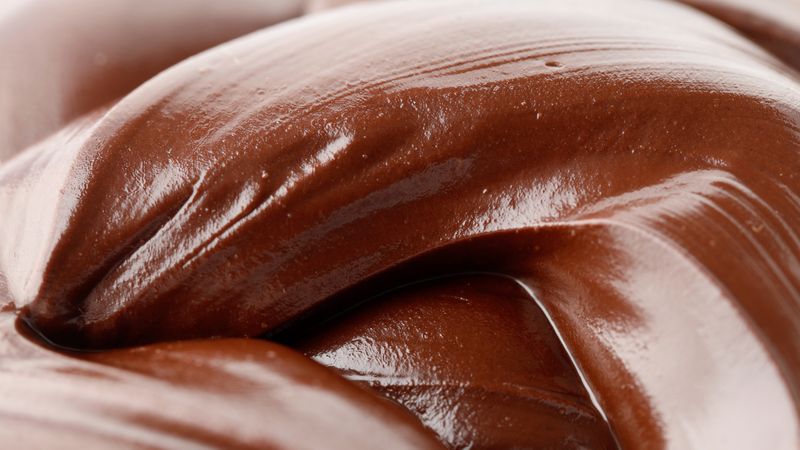 Tempered chocolate melted into a swirl, close up