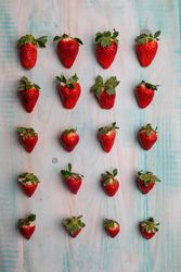 Set of fresh strawberries on desk