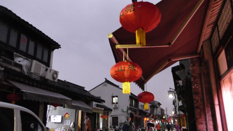 Red Chinese lanterns hung around an awning