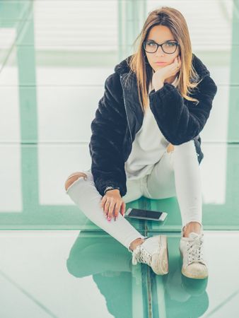 Young woman over a glasses ground