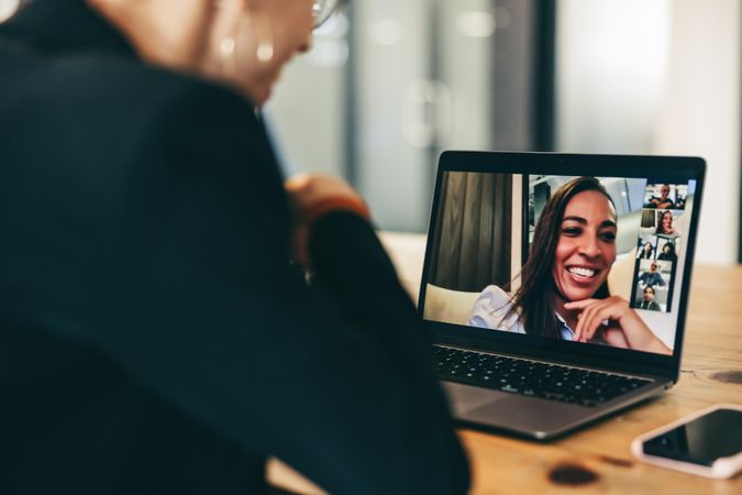 Woman on virtual meeting call on her laptop