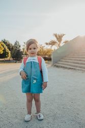 Little girl standing in park