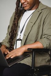 Man in gray suit jacket using laptop computer bDJgp5