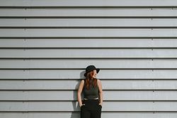 Woman leaning on wall