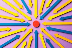 Paper arrows pointed at a red dot in the center