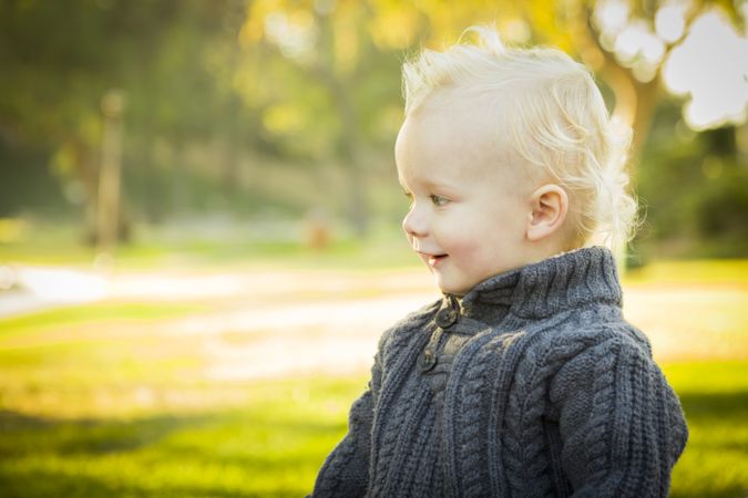 Adorable Blonde Baby Boy Outdoors at the Park.
