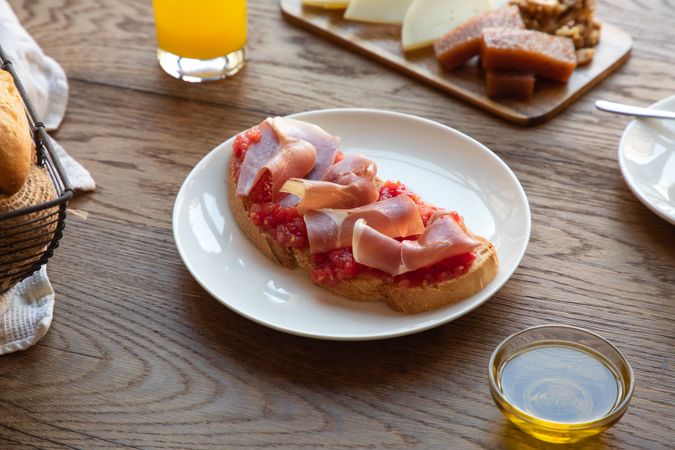 Stylish serving dishes with sandwich for breakfast