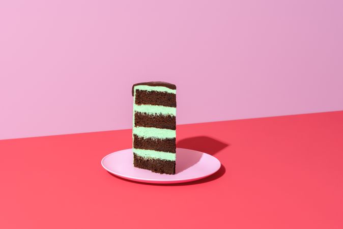 Slice of cake minimalist on a red background
