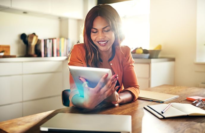 Businesswoman reading on her tablet