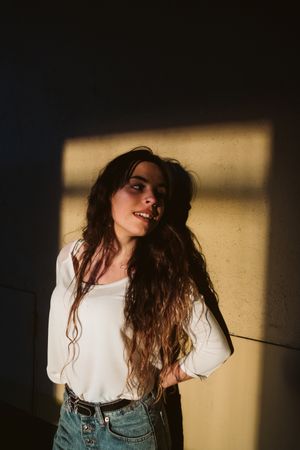 Smiling woman in spot of light