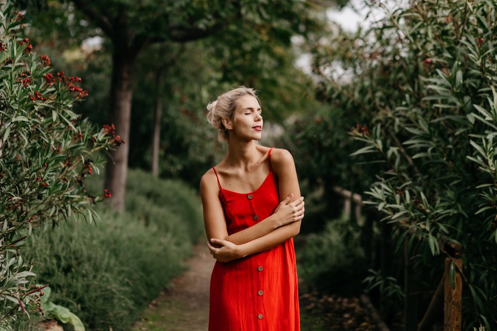 Dreamy woman in summer garden