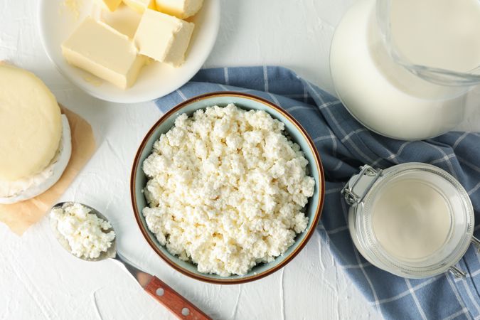 Different dairy products on light background, top view