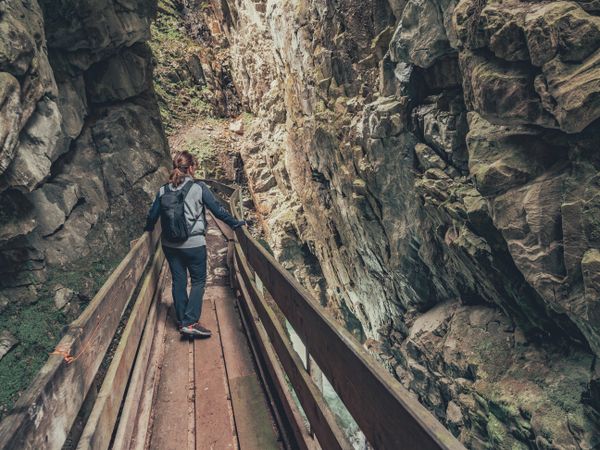 Woman admiring picturesque view of Alps