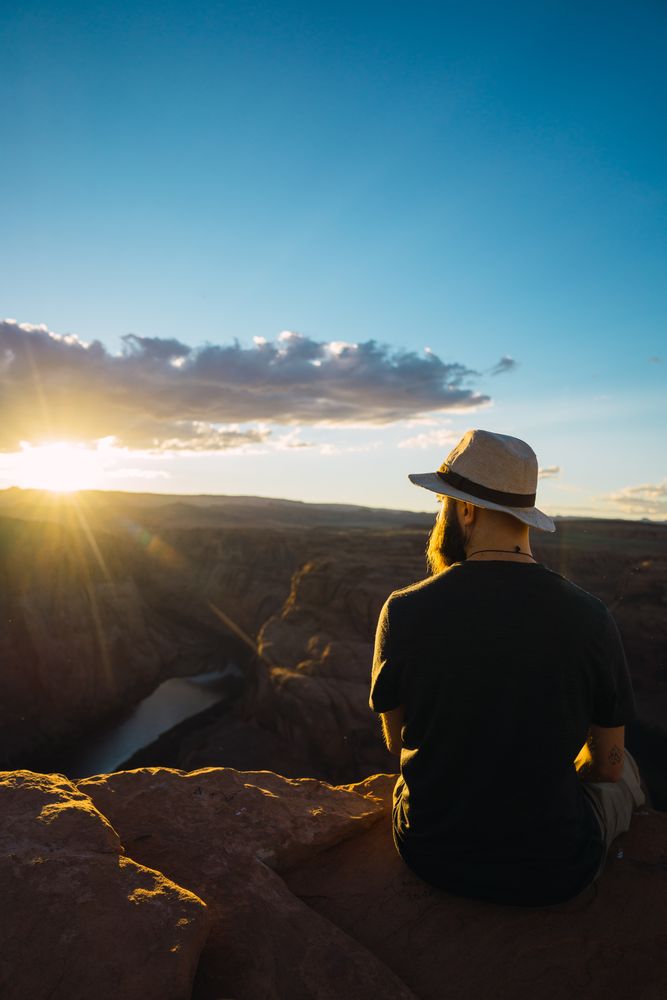 Bearded traveler looking at canyon