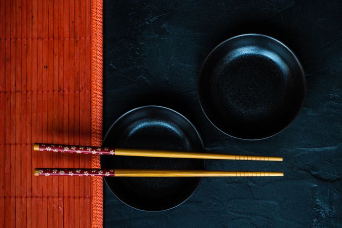 Table setting with chopsticks and two small bowls and copy space