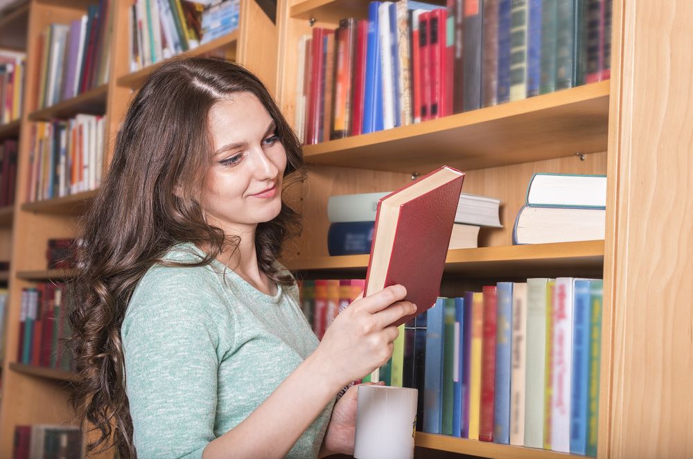 Smiling woman with a book in hand