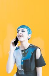 Cheerful futuristic woman talking on smartphone