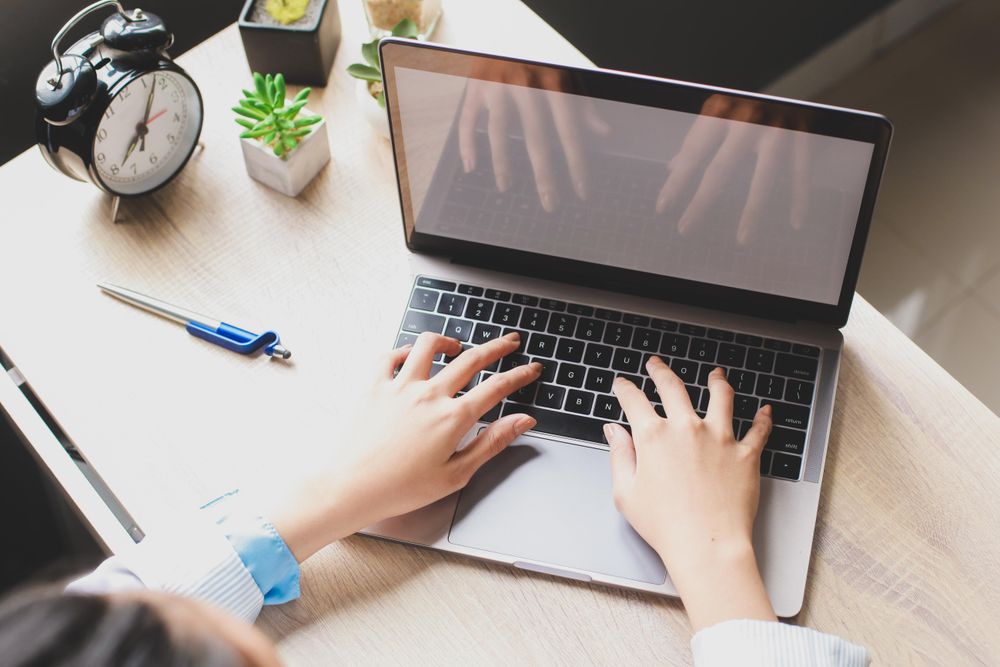 Woman using laptop in an office