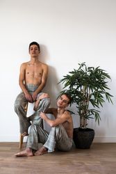 Stylish shirtless gay couple posing