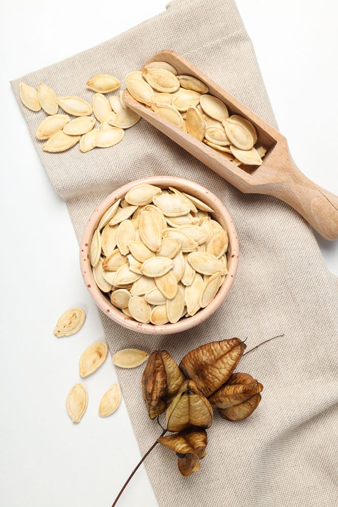 Cooking ingredients for fall season - pumpkin seeds, pumpkin