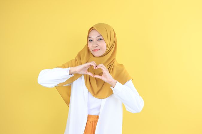 Young Female Making Love Sign with Her Hand
