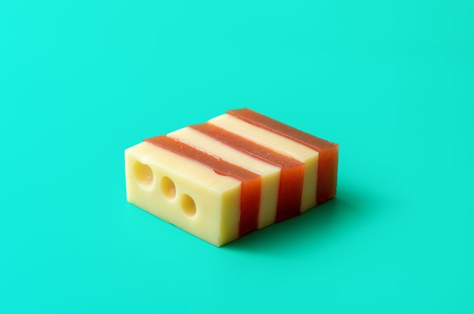 Cheese with quince marmalade snack isolated on a blue background