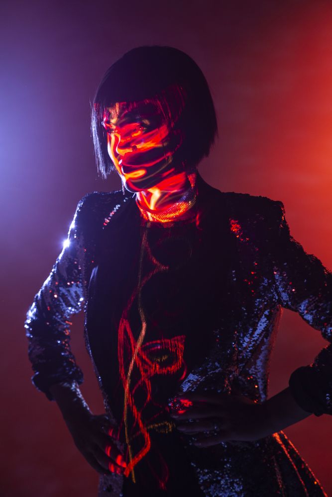 Stylish woman singing on stage