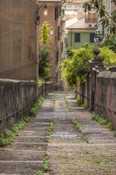 Long tight alley on the hills of Genoa city